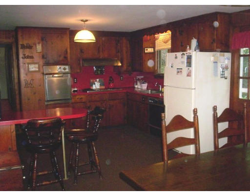 3 Pine Ridge Road Topsfield, MA 01983 - Photo 12 of 29 a kitchen with refrigerator cabinets dining table and chairs