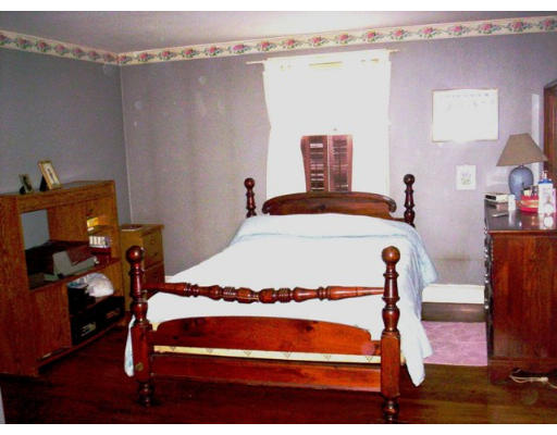 3 Pine Ridge Road Topsfield, MA 01983 - Photo 5 of 29 a bedroom with a bed and a table in it