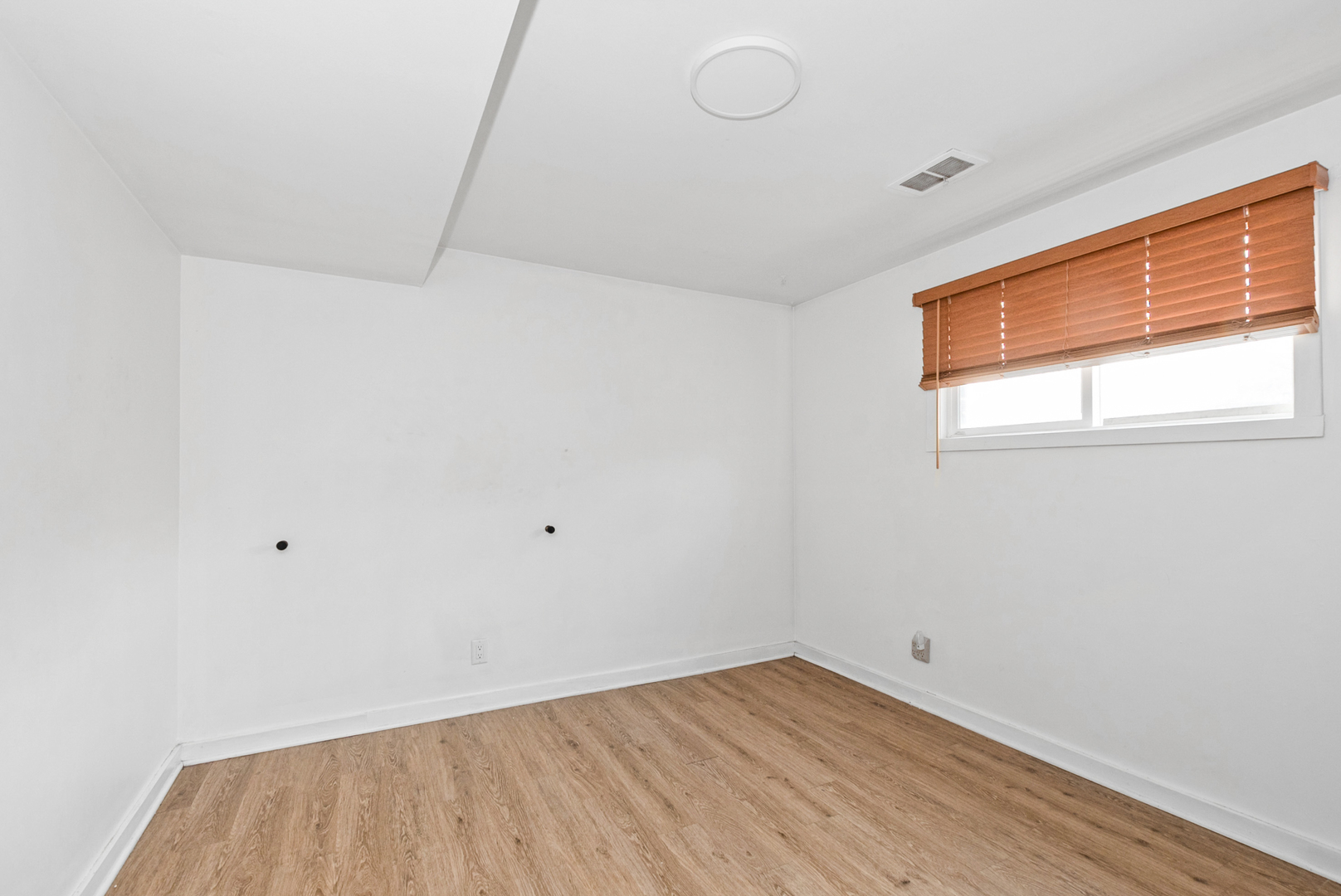 2809 Forest Lane Lansing, IL 60438 - Photo 15 of 24 a view of an empty room with wooden floor and a window