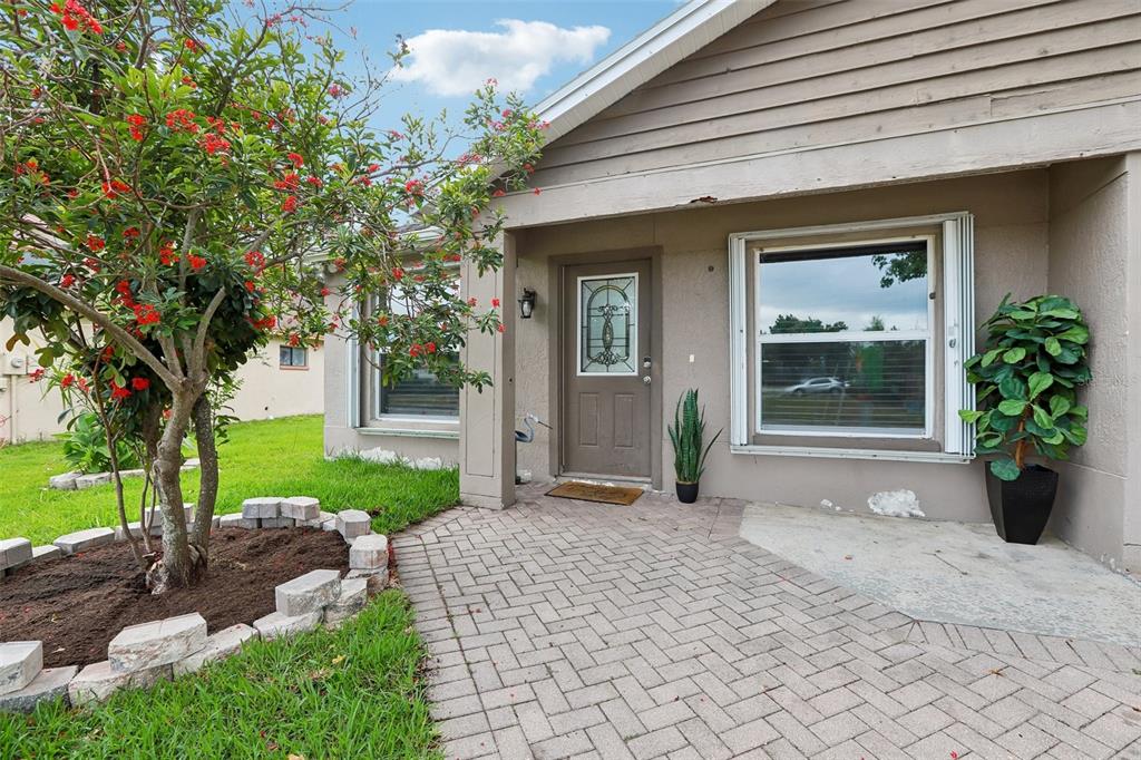 1525 Kestrel Way Brandon, FL 33511 - Photo 5 of 48 a front view of a house with garden