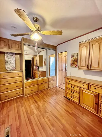 a view of a hardwood floor and staircase