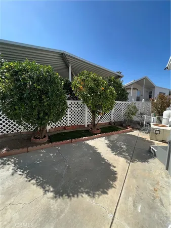 a front view of a house with a yard and a garage
