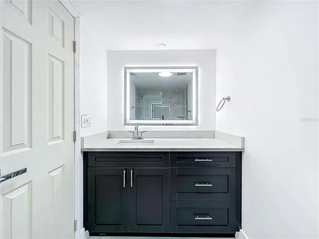 a white toilet sitting next to a bathroom