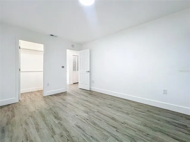 a bathroom with a granite countertop toilet a sink and bathtub