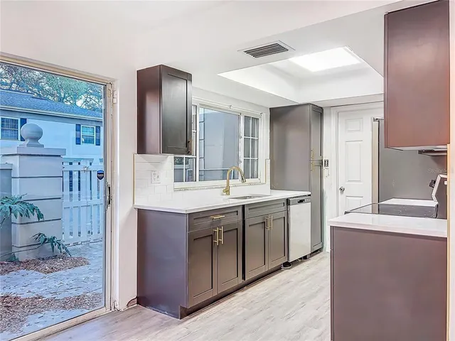 a kitchen with a stove microwave and refrigerator