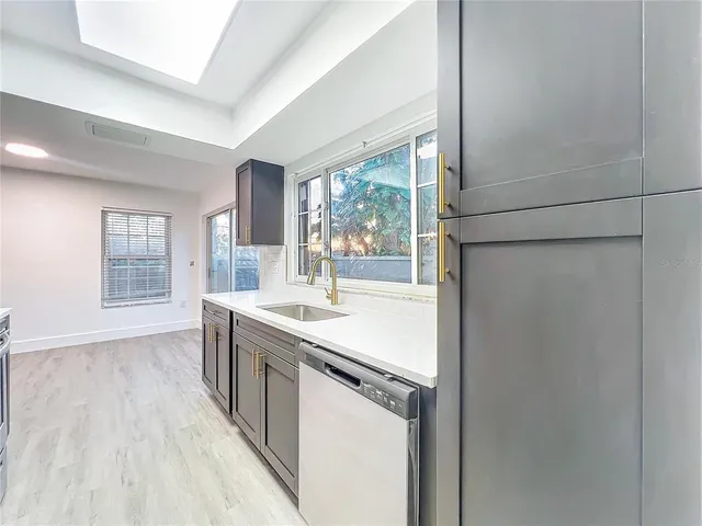 a view of kitchen with wooden floor