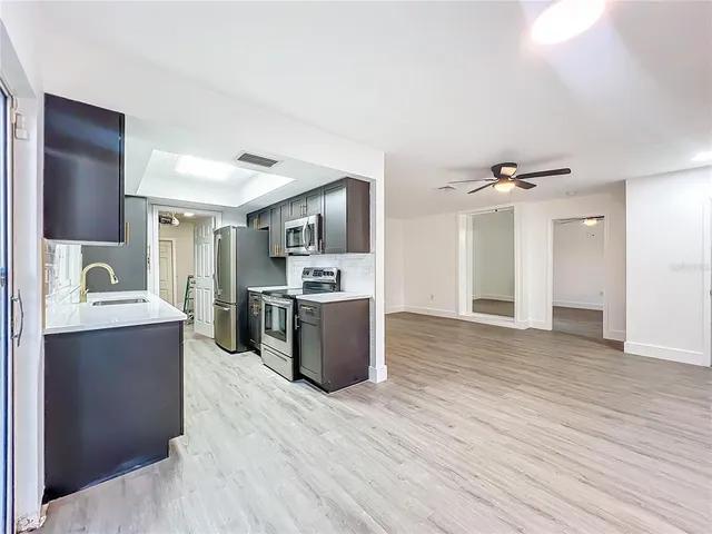 wooden floor in an empty room with a fireplace