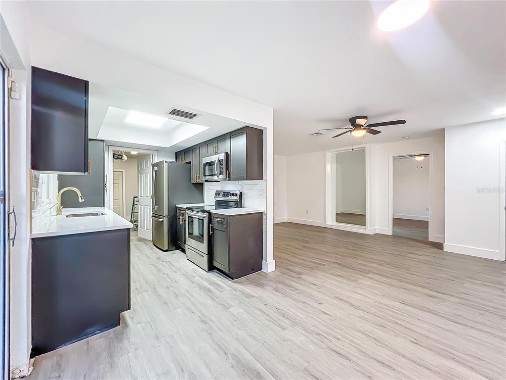 6233 Dewdrop Way Tampa, FL 33617 - Photo 10 of 30 a view of kitchen with wooden floor