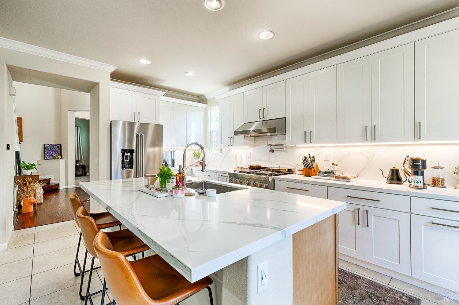 2167 Linwood Avenue Santa Rosa, CA 95404 - Photo 28 of 80 a kitchen with a dining table chairs and white cabinets