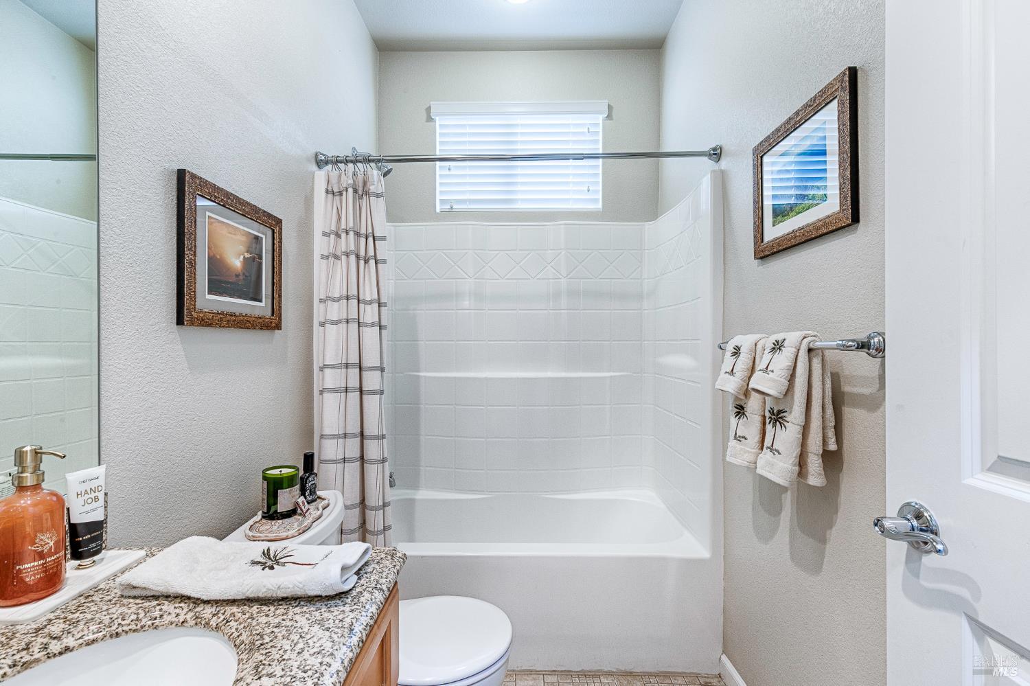 2167 Linwood Avenue Santa Rosa, CA 95404 - Photo 35 of 80 a bathroom with a granite countertop sink a toilet and bathtub