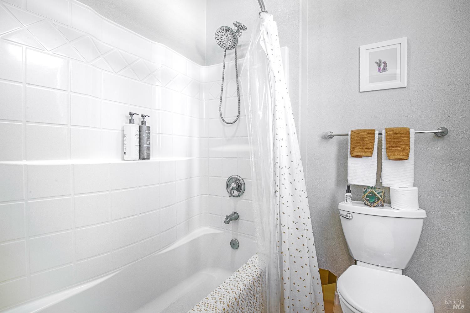 2167 Linwood Avenue Santa Rosa, CA 95404 - Photo 69 of 80 a bathroom with a granite countertop toilet a sink and a bathtub