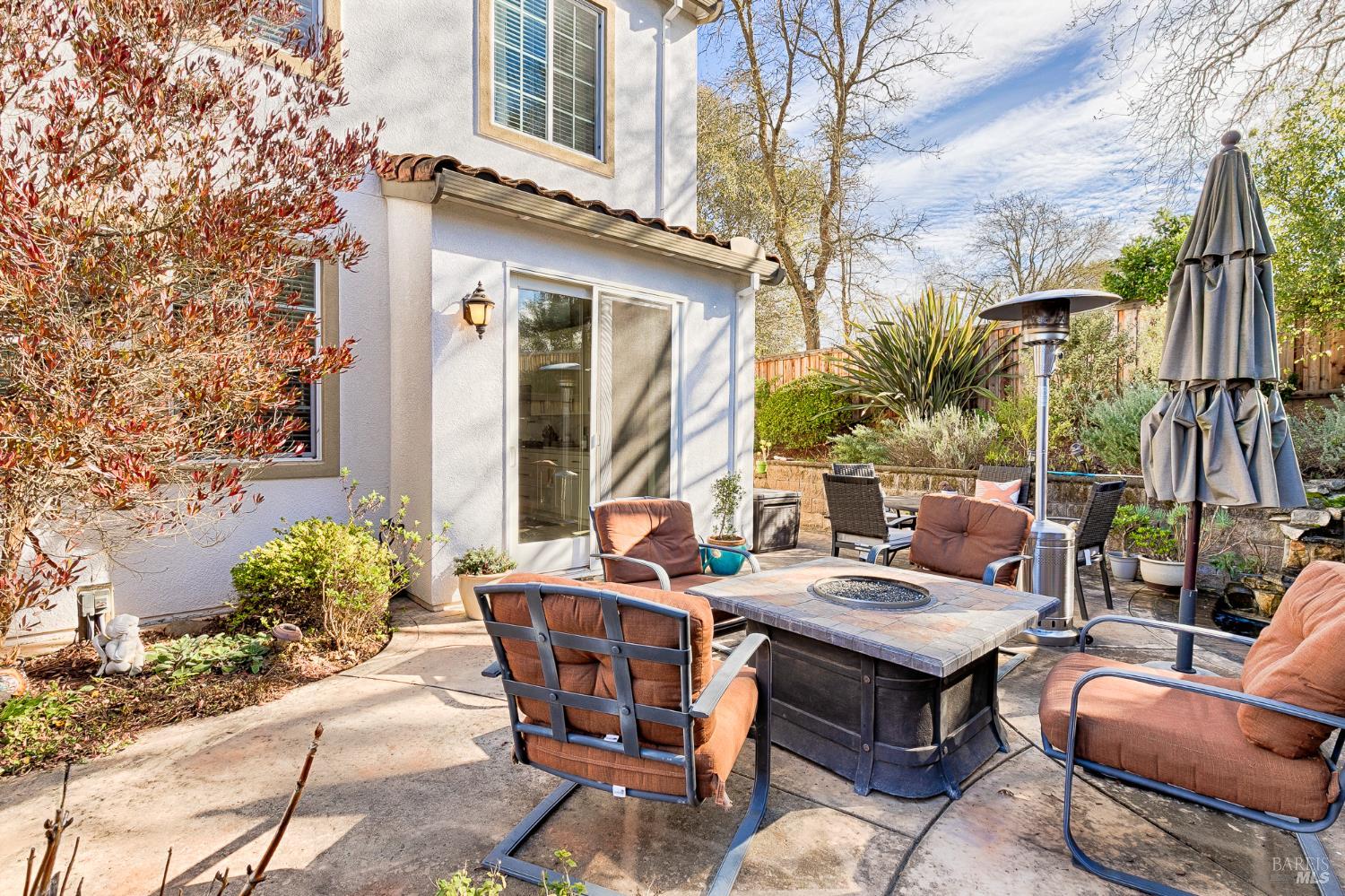 2167 Linwood Avenue Santa Rosa, CA 95404 - Photo 74 of 80 a backyard of a house with barbeque oven table and chairs