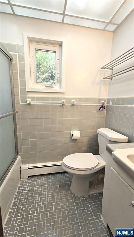 459 Summit Street Ridgewood, NJ 07450 - Photo 11 of 22 a bathroom with a toilet a window and shower