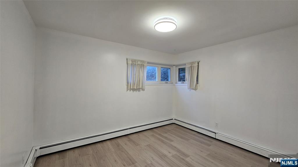 459 Summit Street Ridgewood, NJ 07450 - Photo 12 of 22 a view of a room with wooden floor and white walls