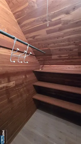 a view of room with wooden floor