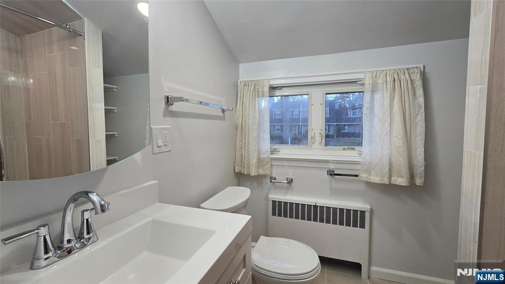 459 Summit Street Ridgewood, NJ 07450 - Photo 16 of 22 a bathroom with a sink and a mirror