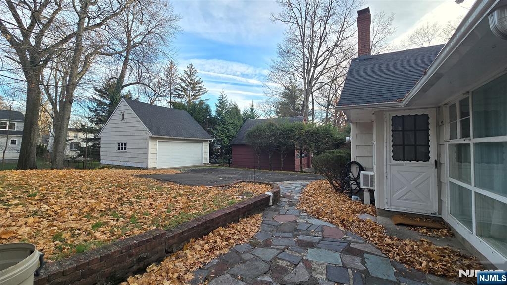 459 Summit Street Ridgewood, NJ 07450 - Photo 20 of 22 a view of house with backyard and trees