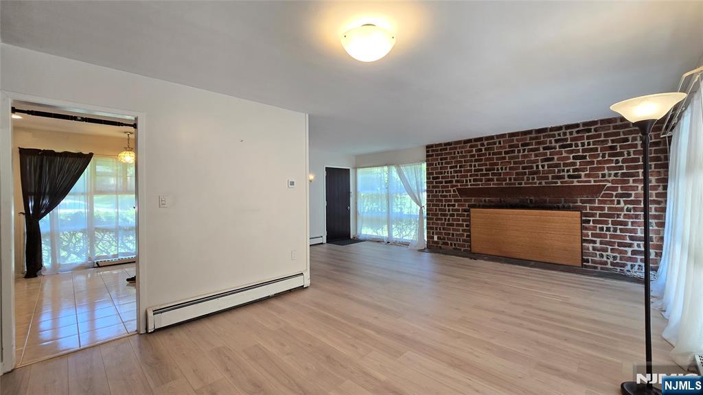 459 Summit Street Ridgewood, NJ 07450 - Photo 6 of 22 a view of an empty room with wooden floor and a window