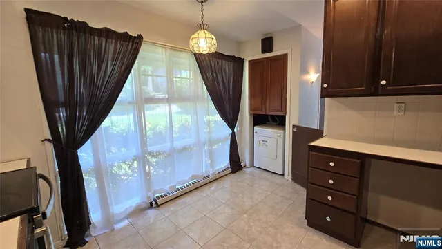 a view of a utility room with windows