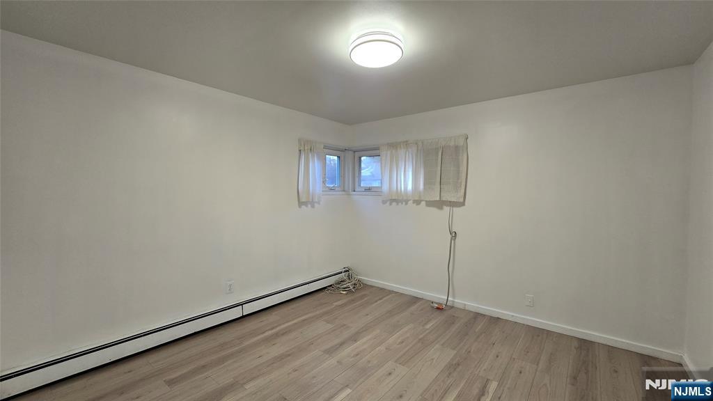 459 Summit Street Ridgewood, NJ 07450 - Photo 10 of 22 an empty room with wooden floor and windows