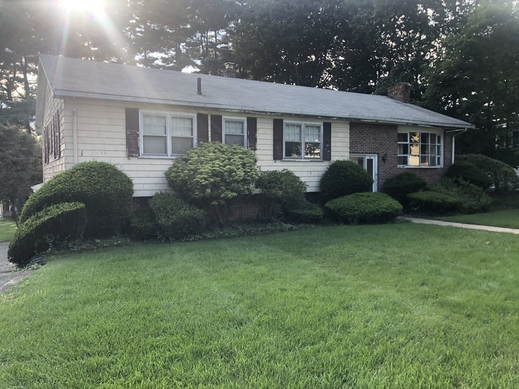 96 MacArthur Road Stoneham, MA 02180 - Photo 3 of 3 a view of a house with backyard and garden