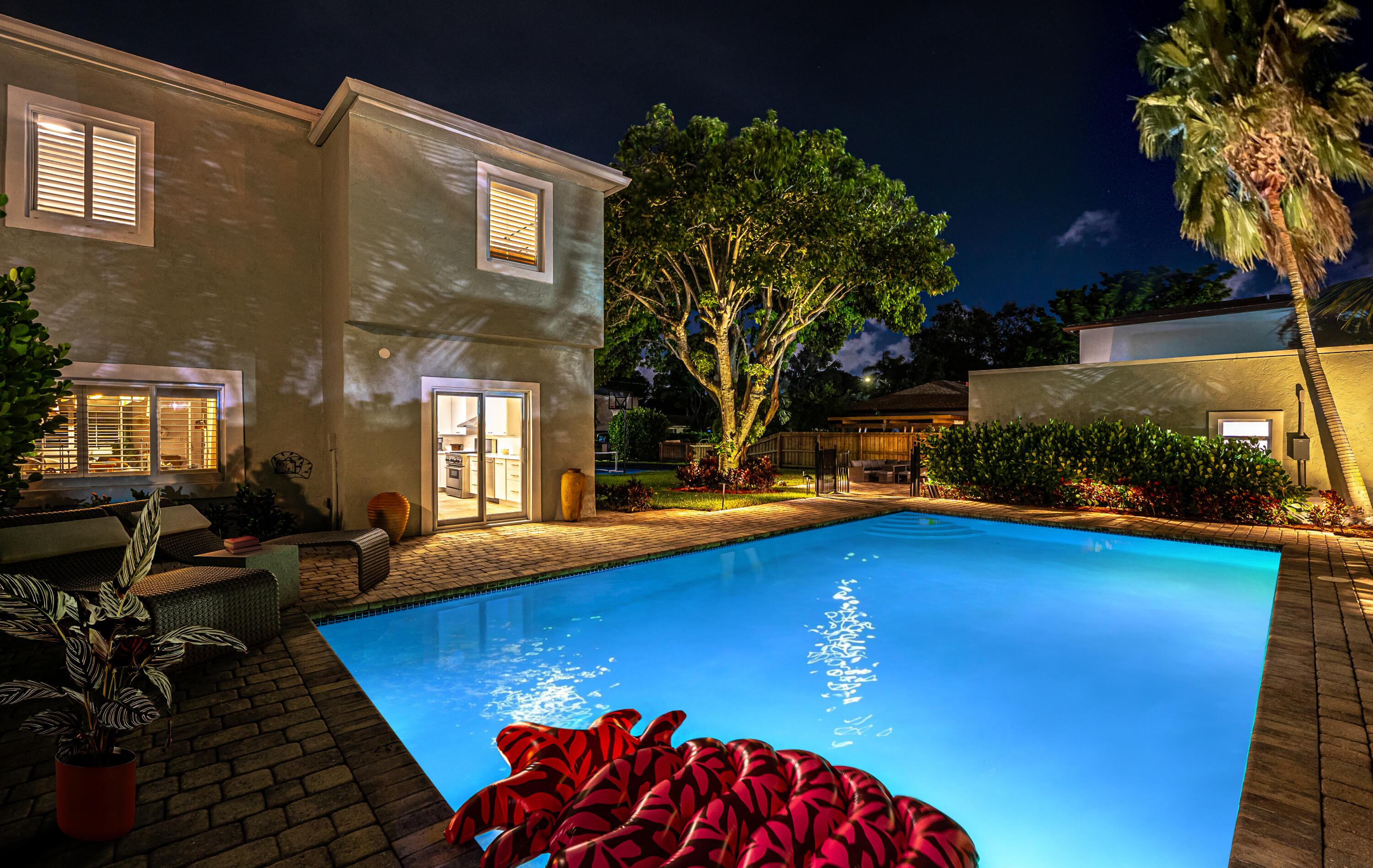 a view of swimming pool with outdoor seating