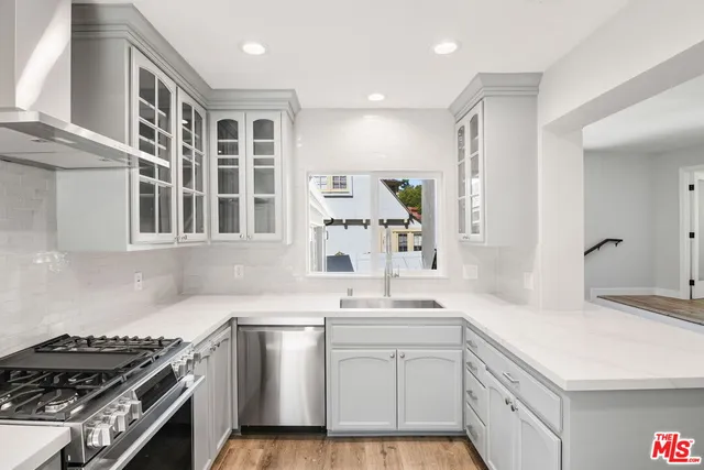 a view of front door with wooden floor and stairs
