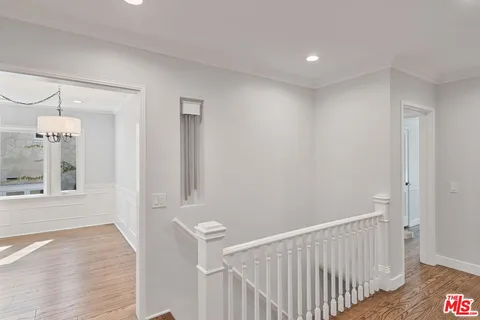 a view of an empty room with window and fireplace