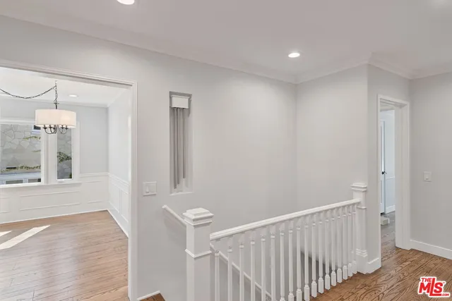 a view of an empty room with window and fireplace