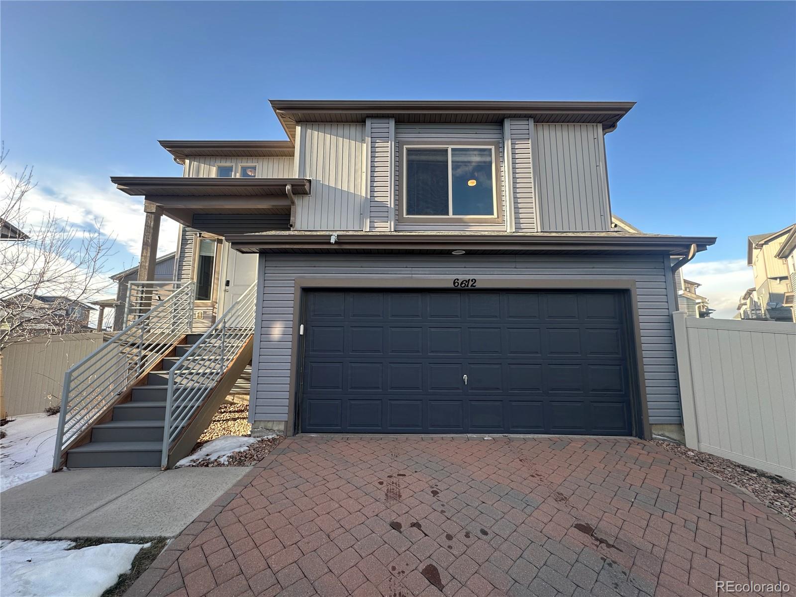 6612 Thicket Pass Lane Colorado Springs, CO 80927 - Photo 1 of 17 a house view with a outdoor space