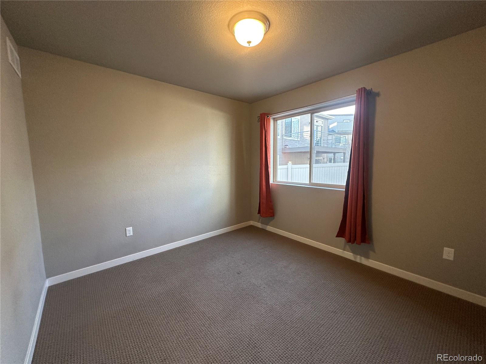 6612 Thicket Pass Lane Colorado Springs, CO 80927 - Photo 11 of 17 an empty room with a window
