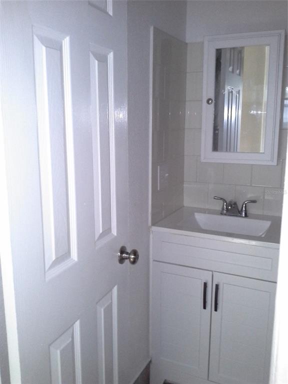 11708 Balm Riverview Road Riverview, FL 33569 - Photo 11 of 19 a bathroom with a sink vanity and mirror