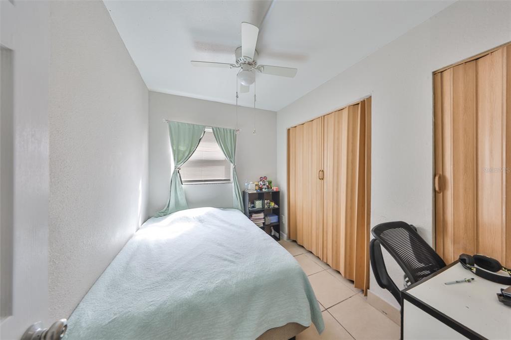 11708 Balm Riverview Road Riverview, FL 33569 - Photo 12 of 38 a bedroom with a bed and a dresser