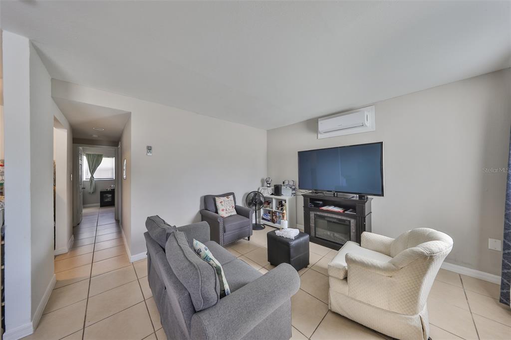 11708 Balm Riverview Road Riverview, FL 33569 - Photo 16 of 38 a living room with furniture and a flat screen tv
