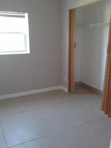 a view of an empty room and a window