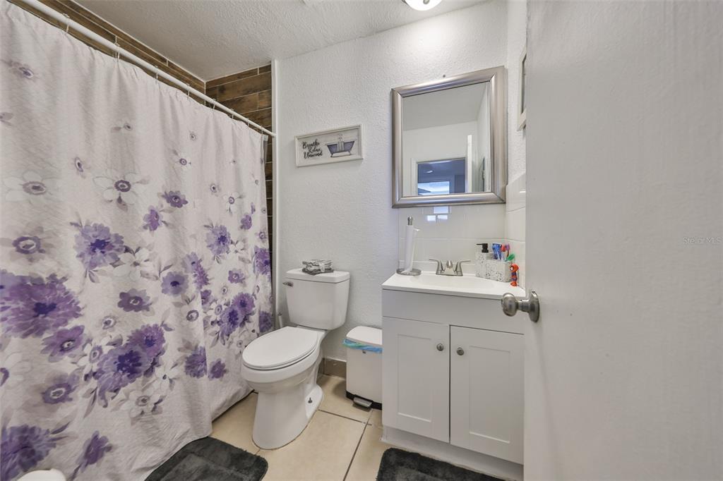 11708 Balm Riverview Road Riverview, FL 33569 - Photo 21 of 38 a bathroom with a sink toilet and mirror