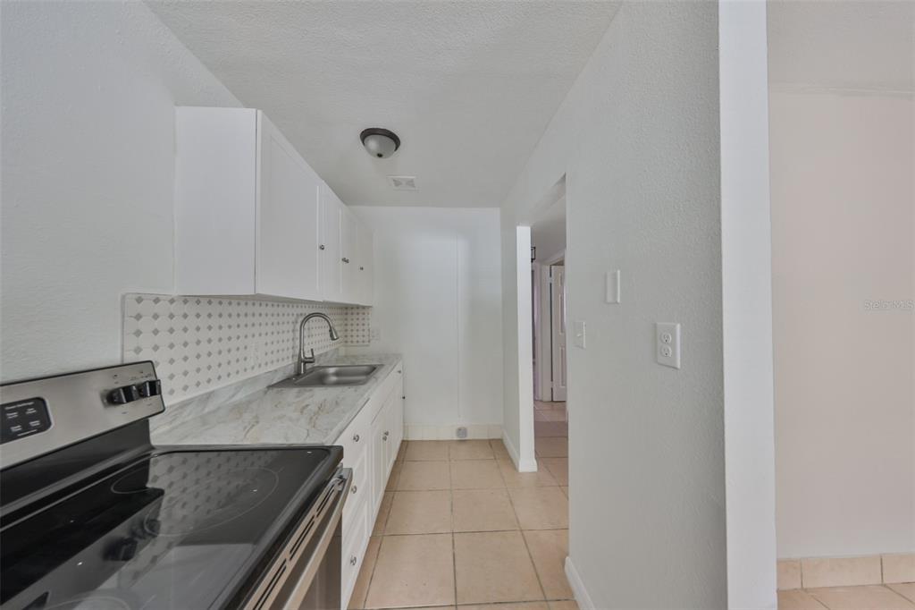 11708 Balm Riverview Road Riverview, FL 33569 - Photo 30 of 38 a kitchen with a stove and a refrigerator