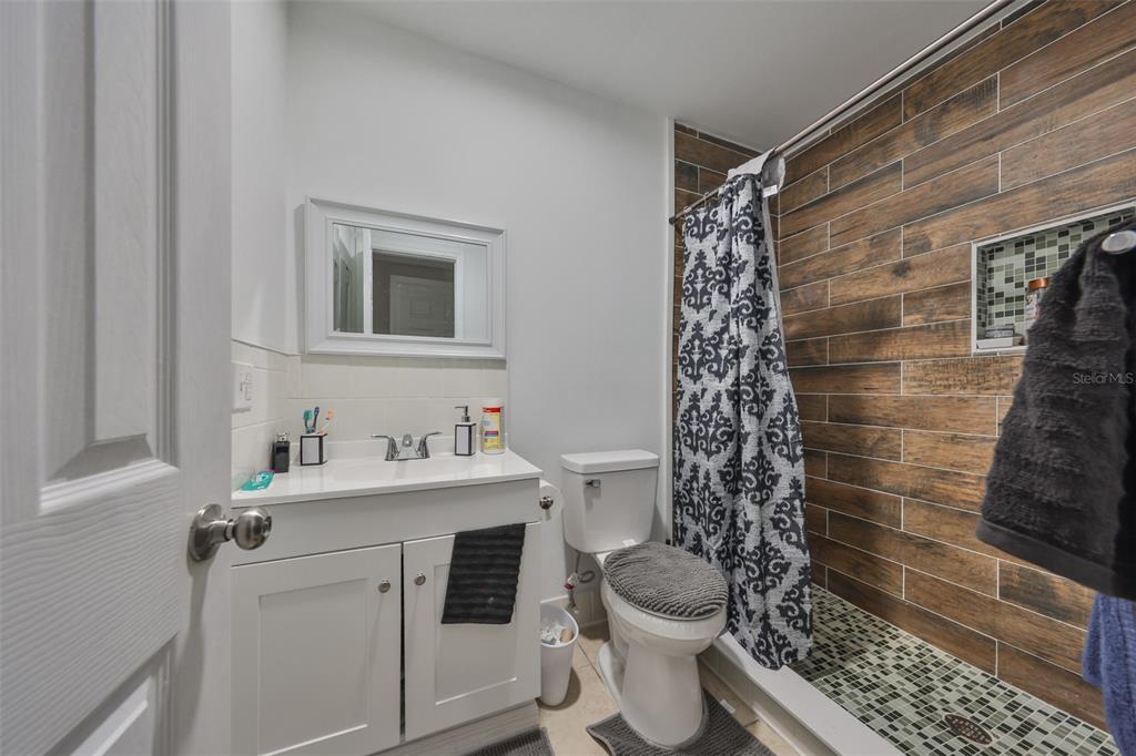 11708 Balm Riverview Road Riverview, FL 33569 - Photo 10 of 38 a bathroom with a sink toilet and shower