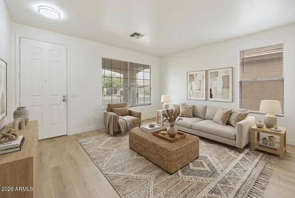 a living room with furniture and a large window
