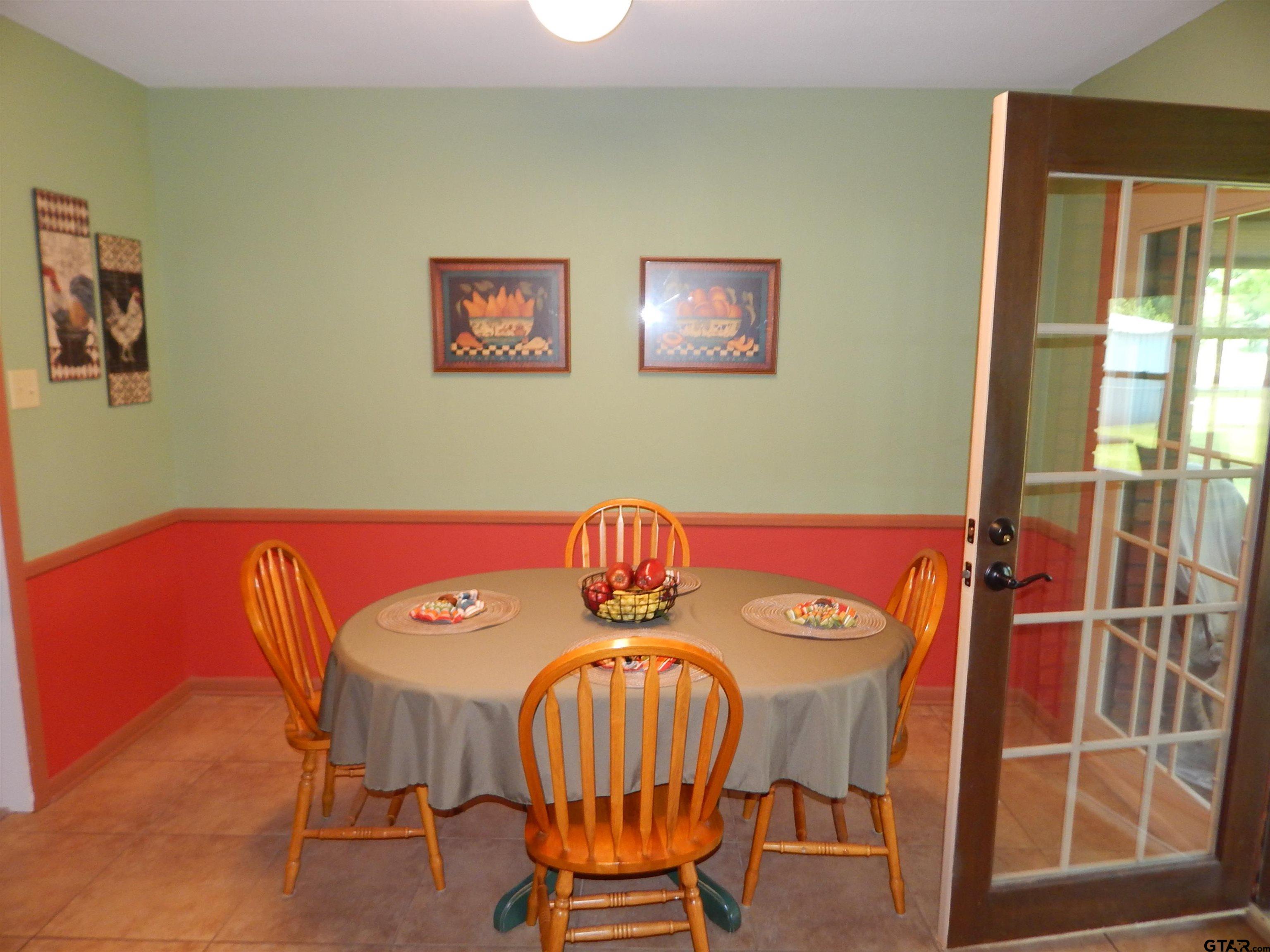 3035 Arrowwood Road Gilmer, TX 75644 - Photo 13 of 32 a view of a dining room with furniture and window