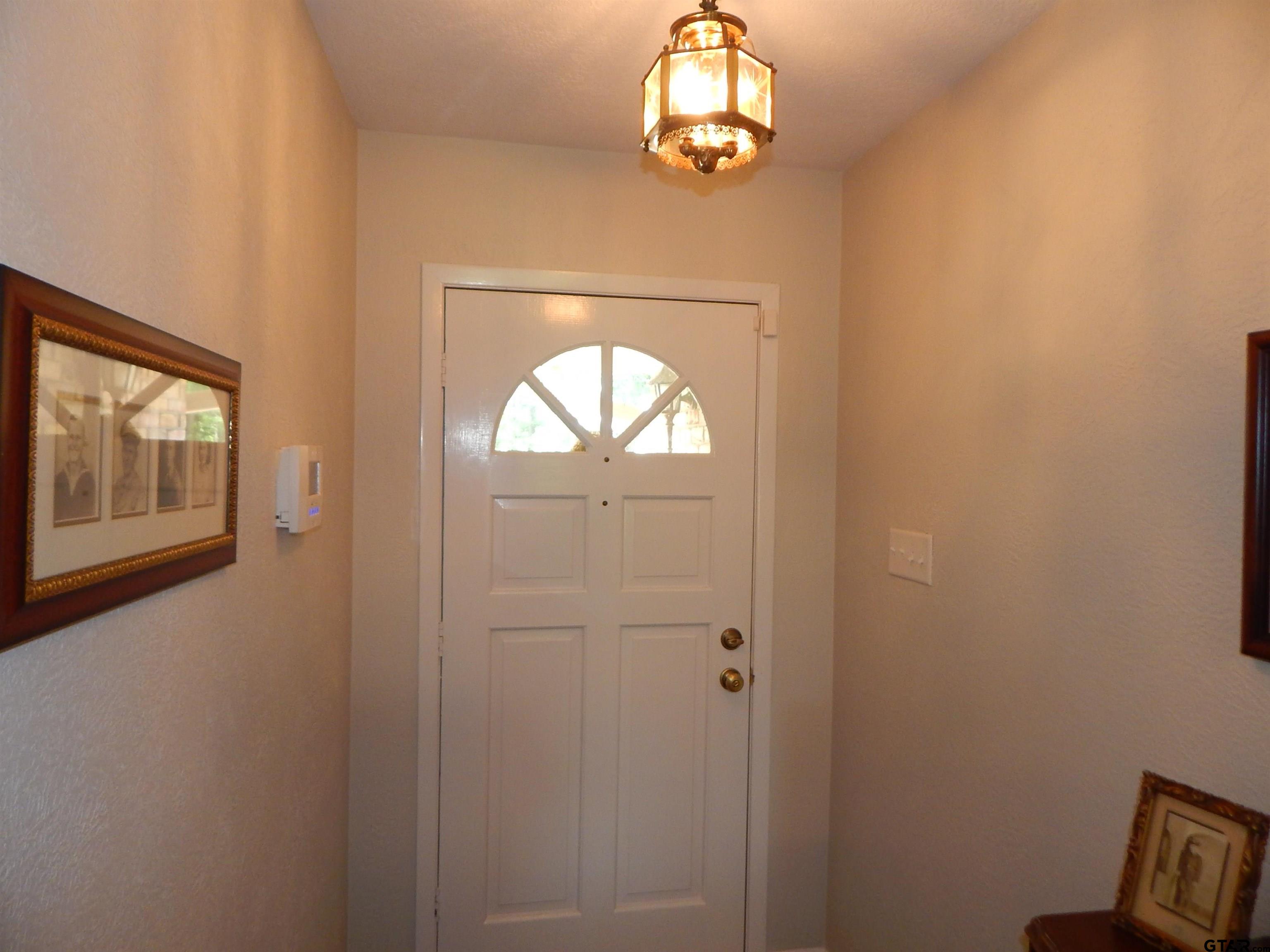 3035 Arrowwood Road Gilmer, TX 75644 - Photo 16 of 32 an empty room with windows