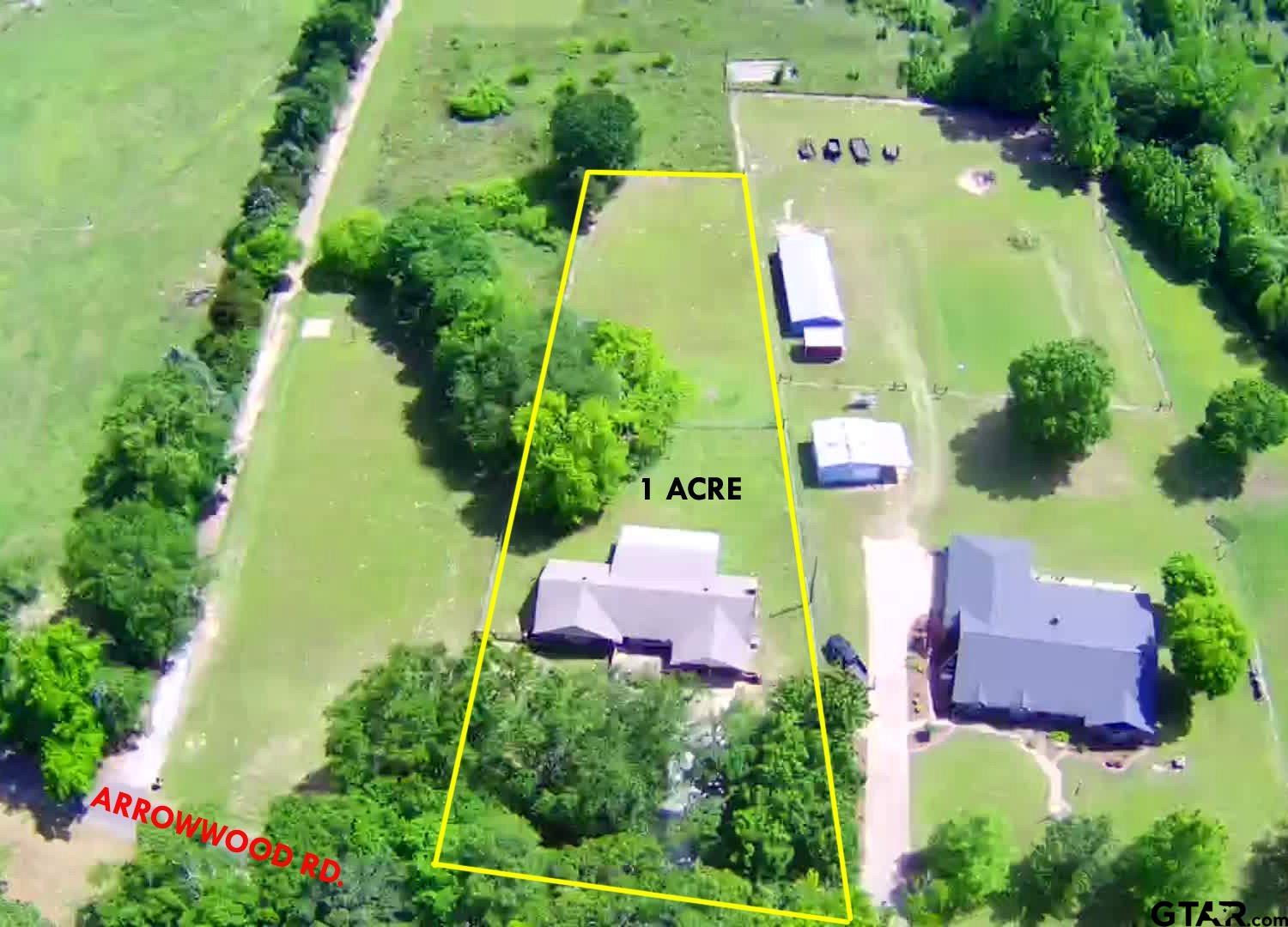3035 Arrowwood Road Gilmer, TX 75644 - Photo 2 of 32 an aerial view of a house with outdoor space and a lake view