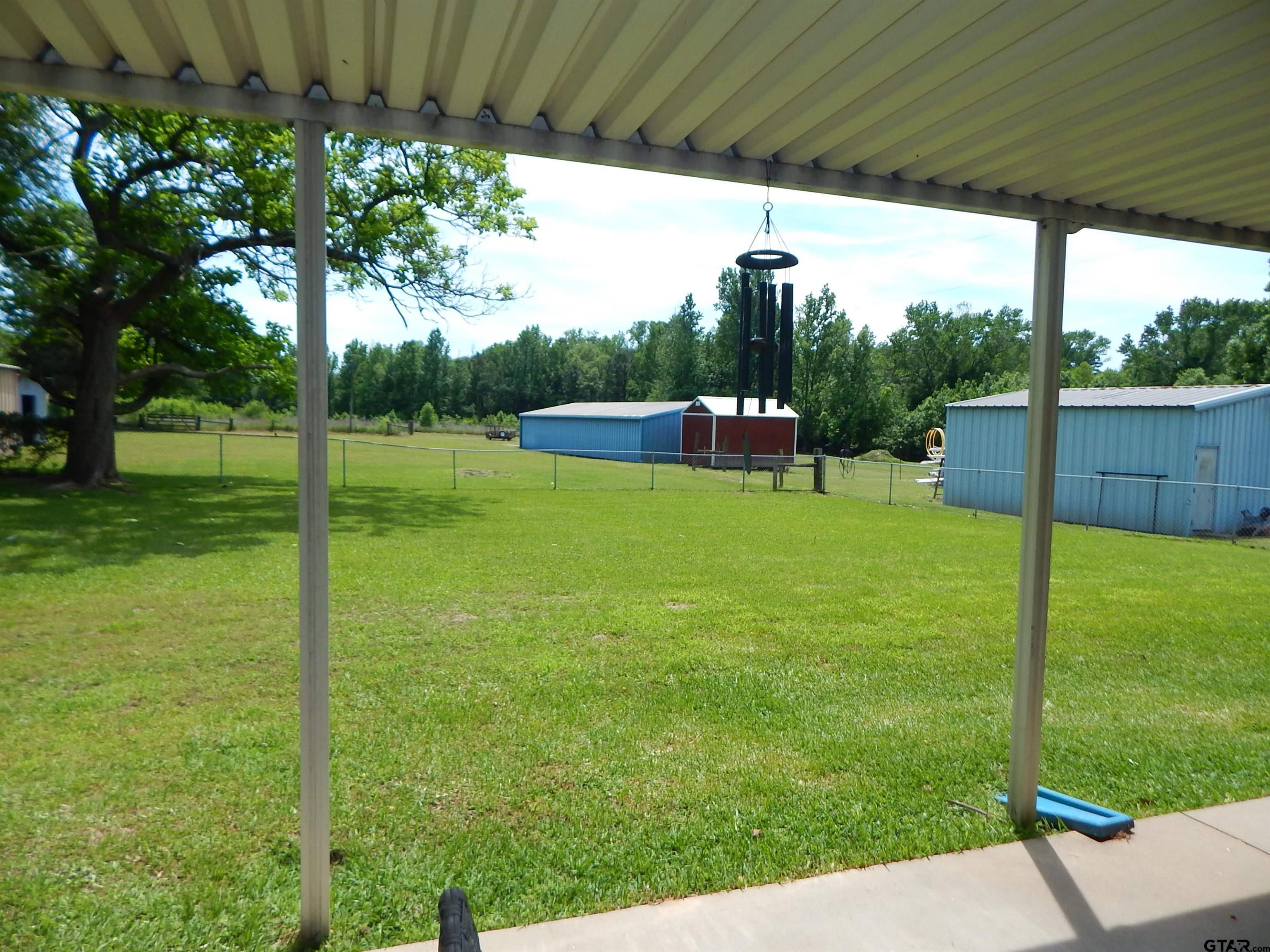 3035 Arrowwood Road Gilmer, TX 75644 - Photo 25 of 32 a view of a backyard with a garden
