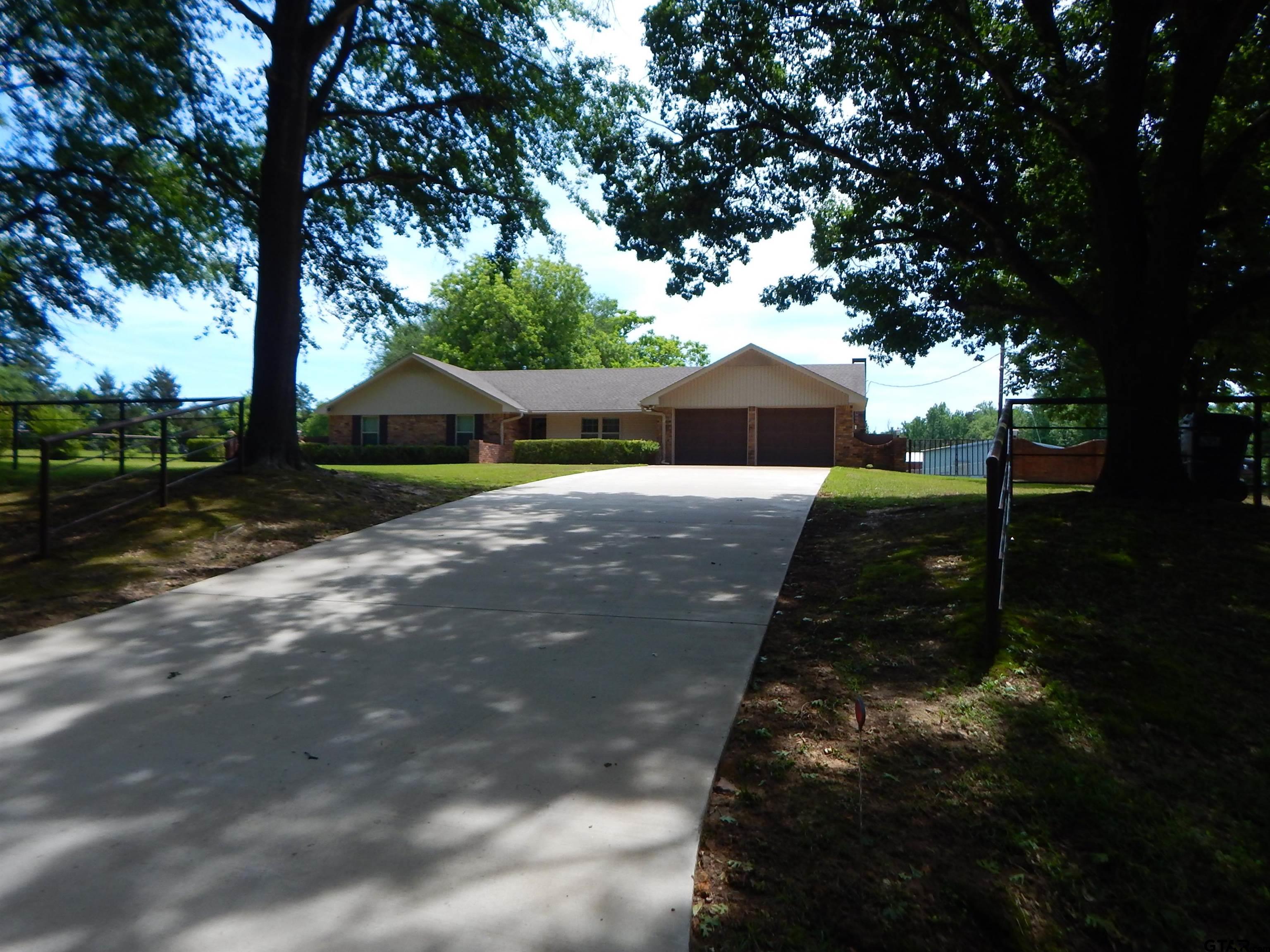 3035 Arrowwood Road Gilmer, TX 75644 - Photo 3 of 32 a view of a house with a yard
