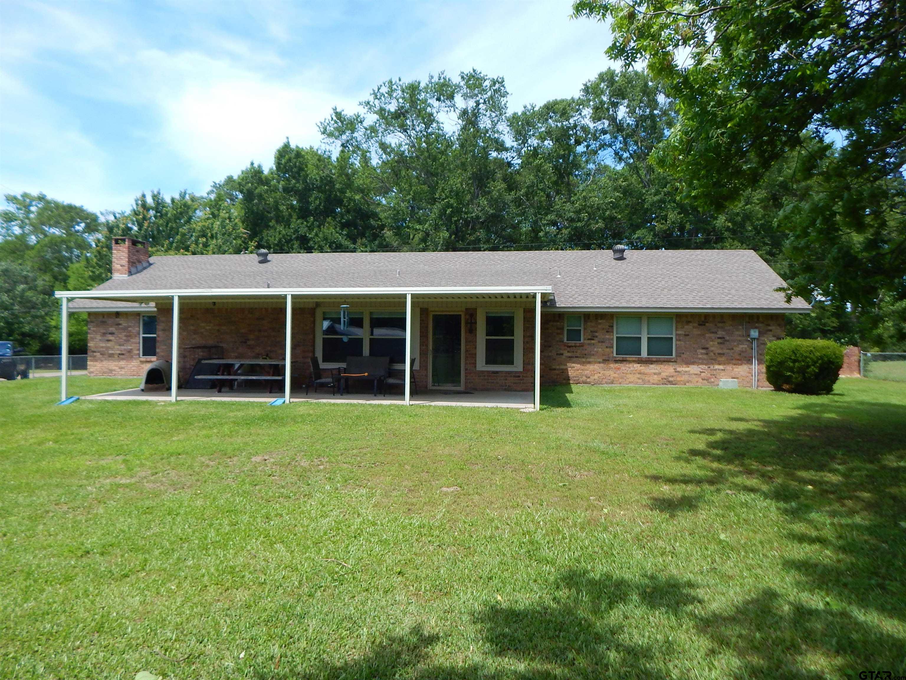 3035 Arrowwood Road Gilmer, TX 75644 - Photo 32 of 32 front view of a house with a yard