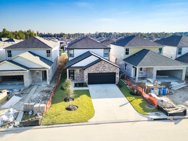 an aerial view of a house with swimming pool