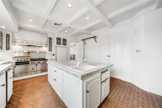 a balcony with furniture and a large window