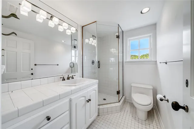 a living room with furniture a fireplace and a window