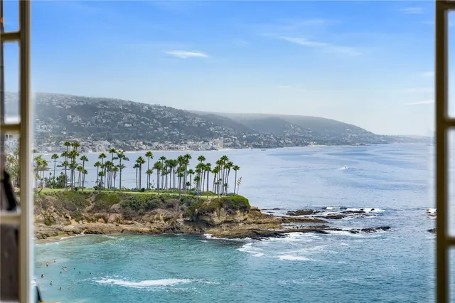 a living room with furniture and a lamp