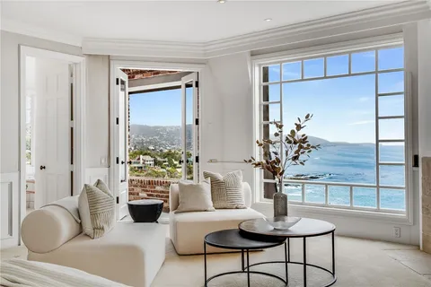 a living room with furniture a fireplace and a fireplace